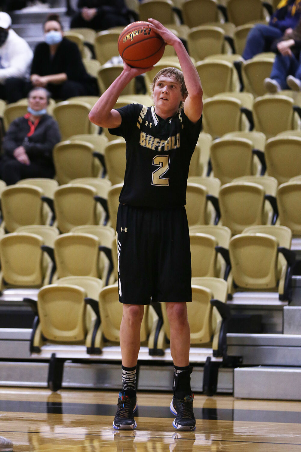 Coy Johnson shoots for three during the first half of the game